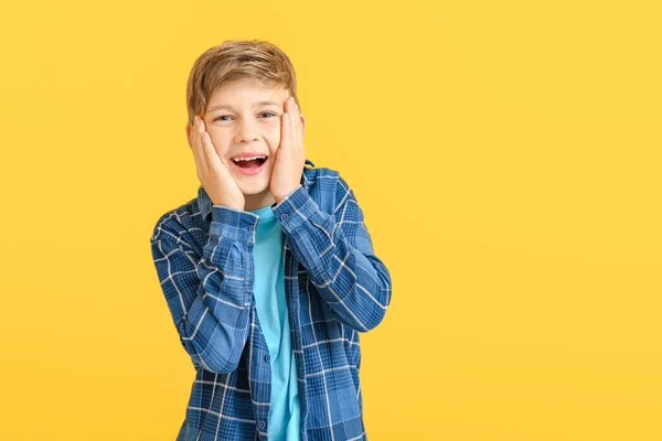 Happy little boy with healthy teeth on color background — Stock Photo, Image