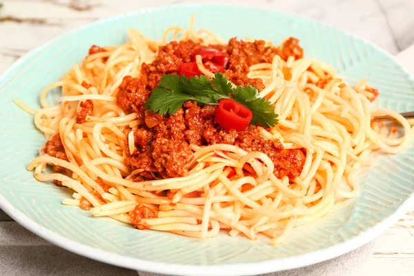 Plate with tasty pasta bolognese on table, closeup — Stock Photo, Image