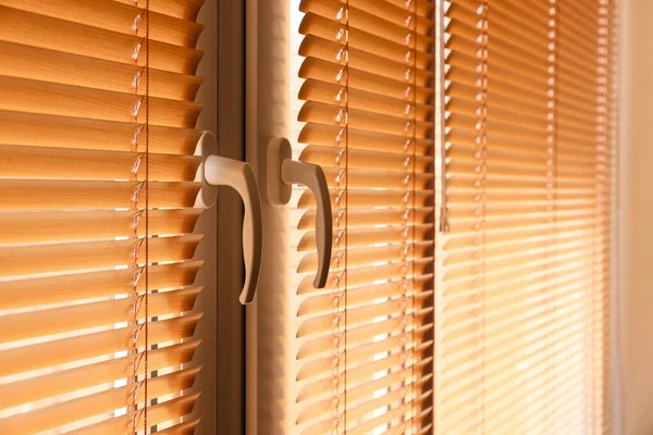 Modern blinds hanging on window