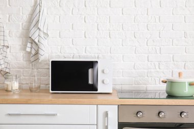 Interior of kitchen with modern microwave oven