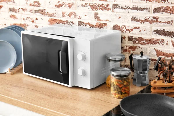Modern microwave oven in kitchen — Stock Photo, Image