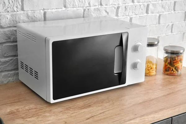 Modern microwave oven in kitchen — Stock Photo, Image