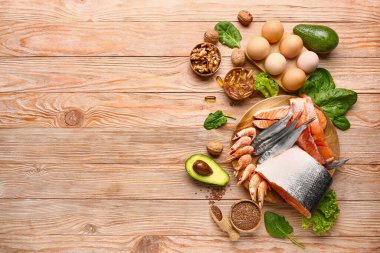 Healthy products rich in omega-3 on wooden background