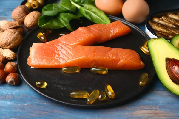 Healthy products rich in omega-3 on wooden background — Stockfoto