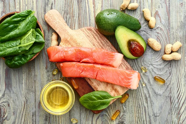 Healthy products rich in omega-3 on wooden background — Stockfoto
