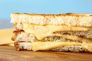 Tasty sandwiches with cheese on table, closeup
