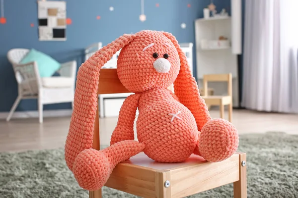 Cute baby toy on chair — Stock Photo, Image