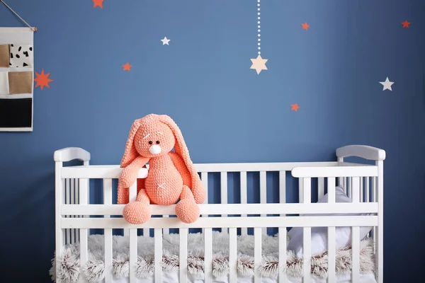 Cute baby toy on crib