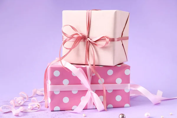 Packed gifts on color background — Stock Photo, Image