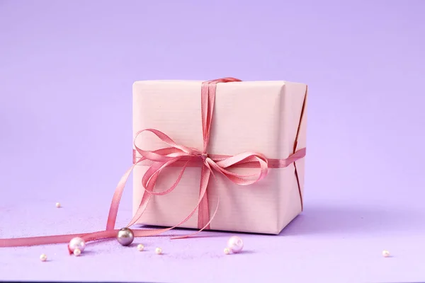 Packed gift on color background — 스톡 사진
