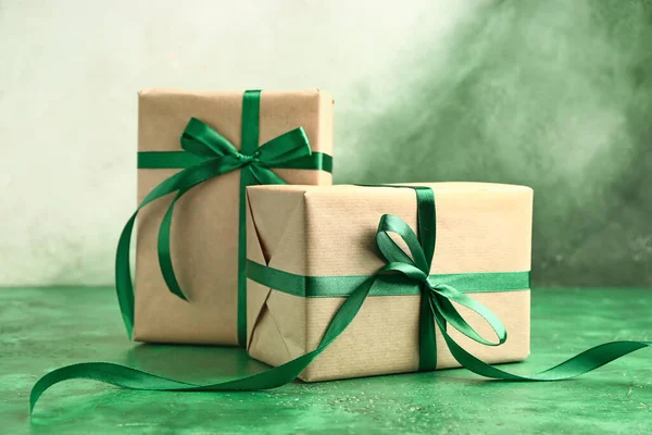 Packed gifts on color background — 스톡 사진