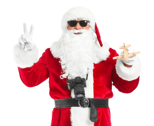 Cool Santa Claus s hračkou letadlo na bílém pozadí. Koncept dovolené — Stock fotografie