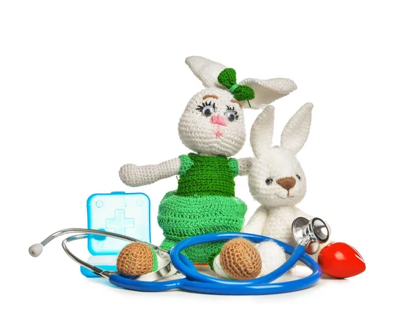 Stethoscope, pills and baby toys on white background — Stock Photo, Image