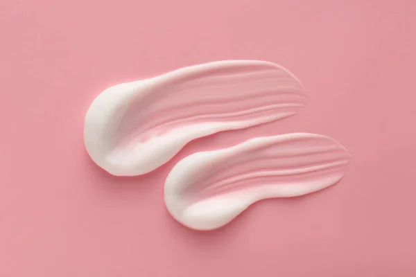 Sample of cream on color background — Stock Photo, Image