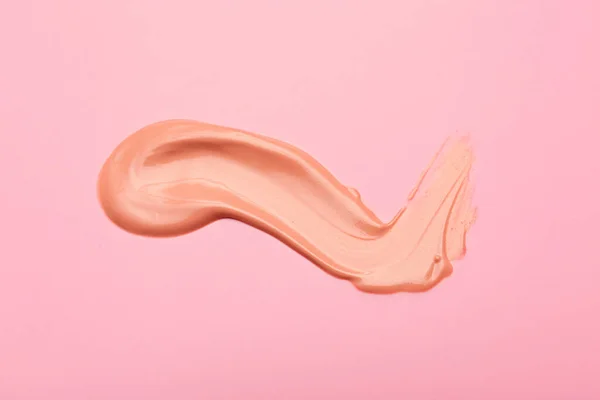 Sample of BB cream on color background — Stock Photo, Image