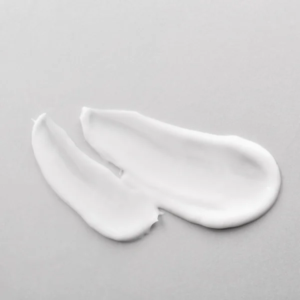 Sample of cream on light background — Stock Photo, Image