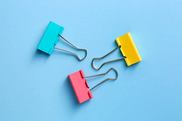 Binder clips for paper on color background