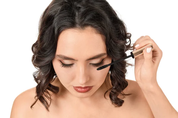 Makeup artist working with beautiful young woman on white background — Stock Photo, Image