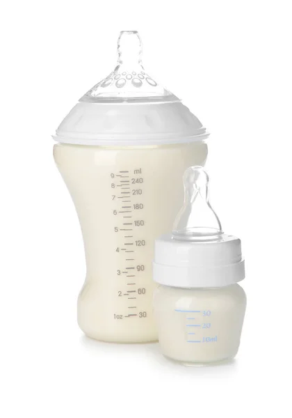 Bottles of milk for baby on white background — Stock Photo, Image
