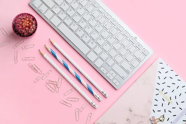 Composition with PC keyboard and stationery on pink background — 스톡 사진