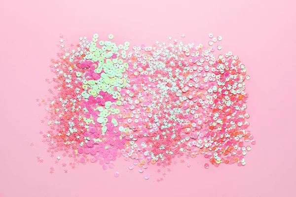 Many glitters on pink background — Stock Photo, Image