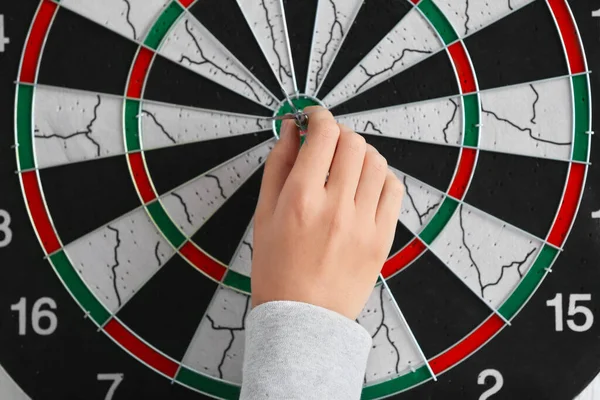 Young woman playing darts indoors, closeup — 스톡 사진