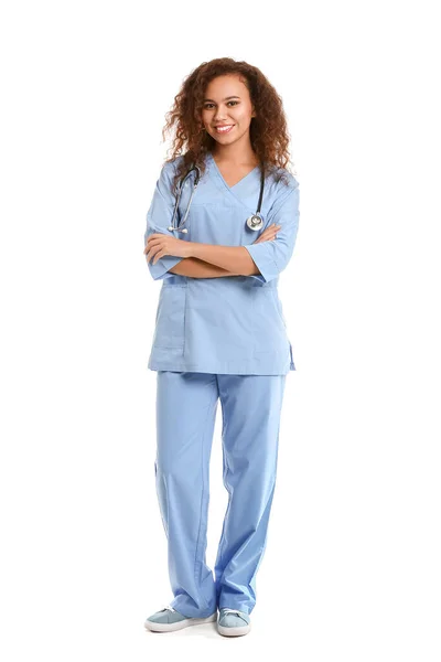 Young African-American nurse on white background — 스톡 사진