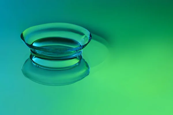 Contact lens on color background — Stock Photo, Image