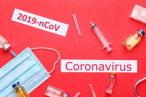 Protective mask and medicines for Coronavirus on color background