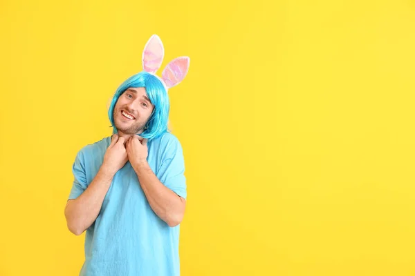 Man in funny disguise on color background. April fools' day celebration — ストック写真