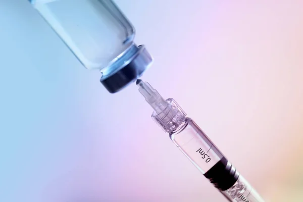 Syringe with filler for cosmetology and ampule on light background, closeup — 스톡 사진