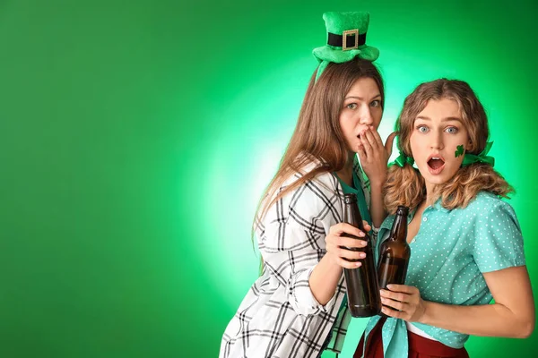 Surprised women with beer on color background. St. Patrick's Day celebration — 스톡 사진