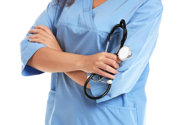 Young African-American nurse with stethoscope on white background — 스톡 사진