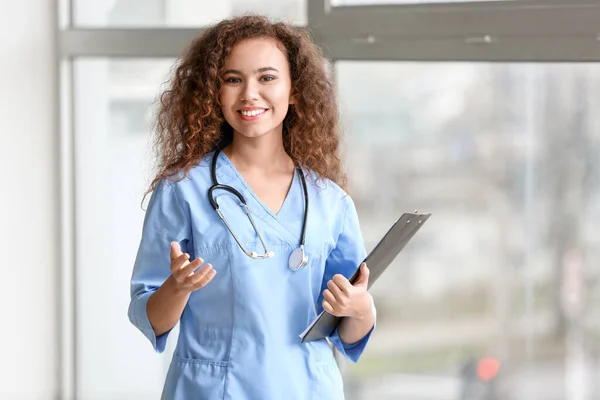 Young African-American nurse in clinic — Stock Photo, Image