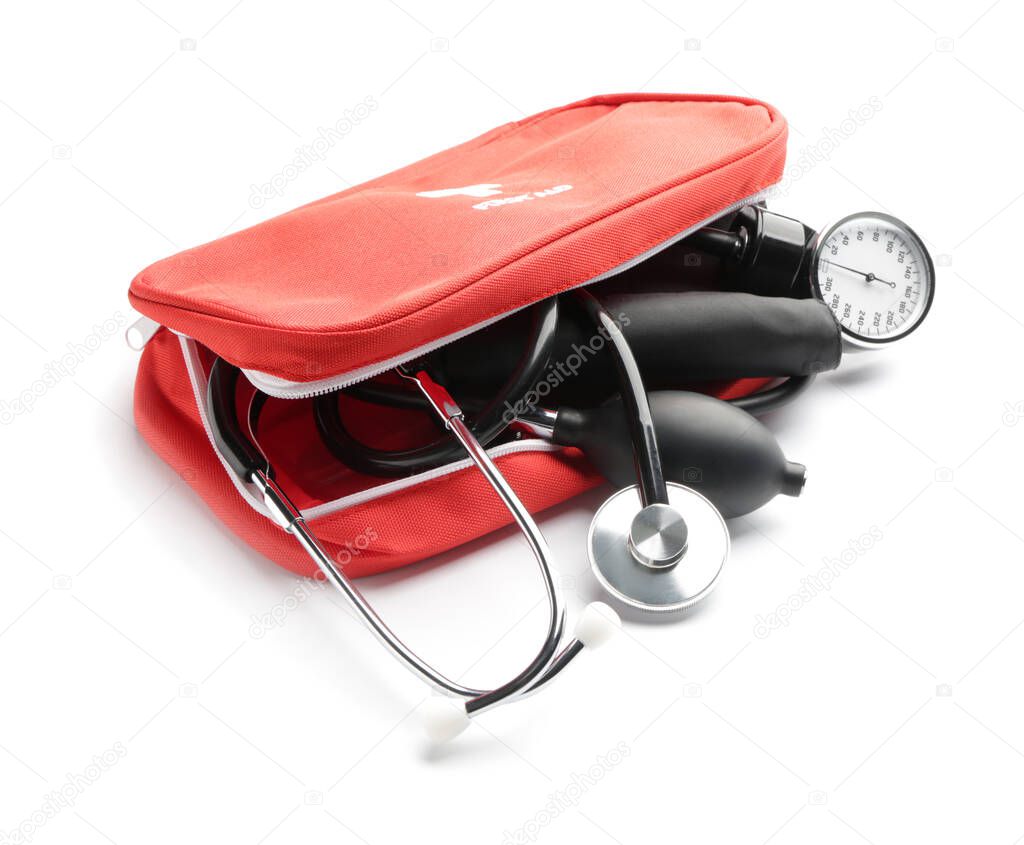 Bag with sphygmomanometer and stethoscope on white background