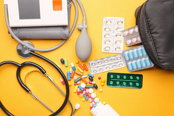 First aid kit on color background — Stock Photo, Image