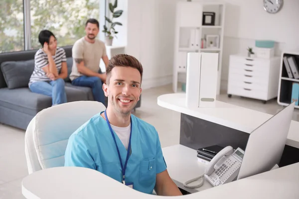Portrait of male receptionist in clinic — Stock Photo, Image