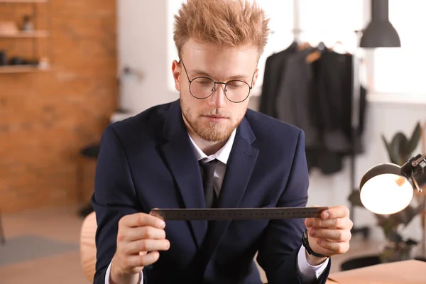Young tailor working in atelier — Stock Photo, Image