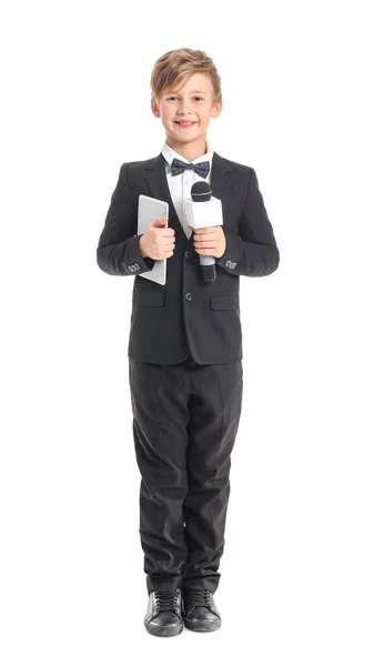 Little journalist with microphone and tablet computer on white background — Stok fotoğraf