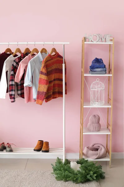 Interior of modern dressing room with winter clothes — Stock Photo, Image