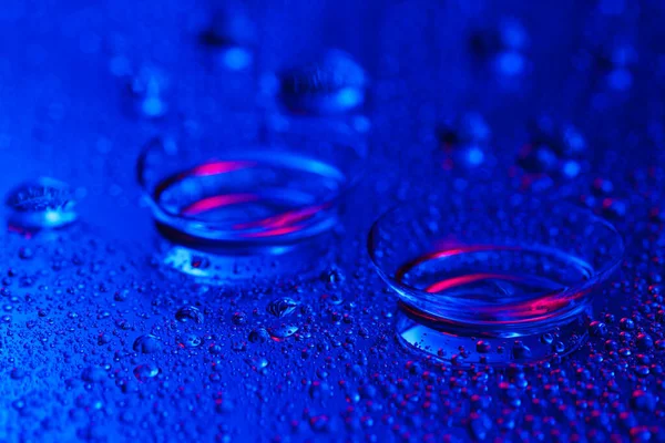 Contact lenses on color background — Stock Photo, Image