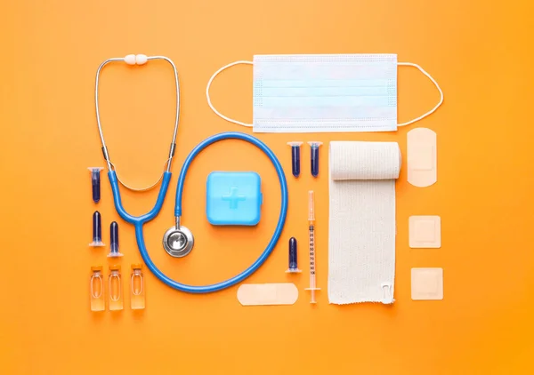 Set of medical supplies on color background — Stock Photo, Image