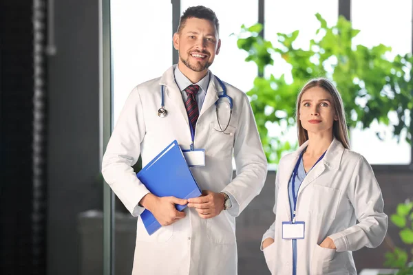 Team of doctors in hall of clinic — Stock Photo, Image