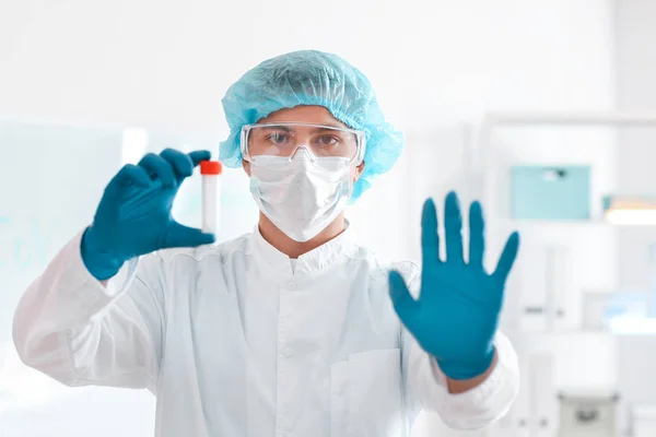 Scientist with sample in test tube in laboratory. Concept of epidemic — Stock Photo, Image