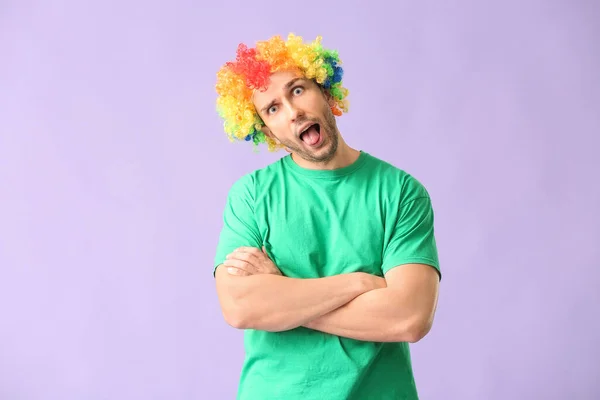 Man in funny disguise on color background. April fools' day celebration — Stock Photo, Image