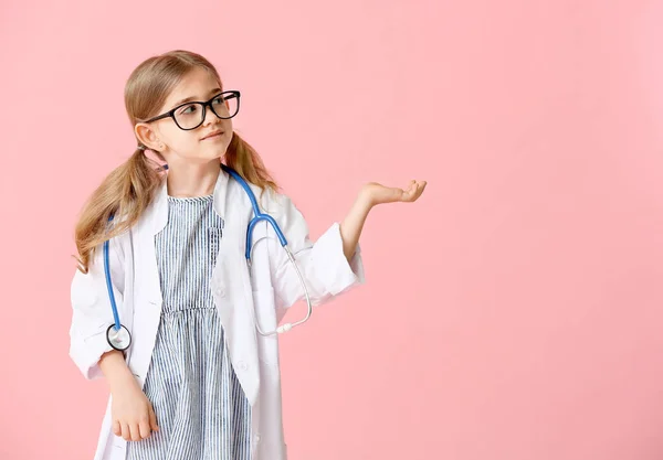 Cute little doctor on color background — Stock Photo, Image