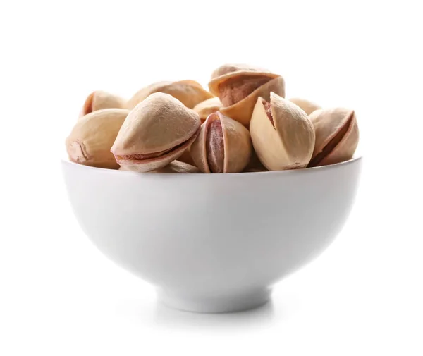 Bowl with tasty pistachio nuts on white background — Stock Photo, Image