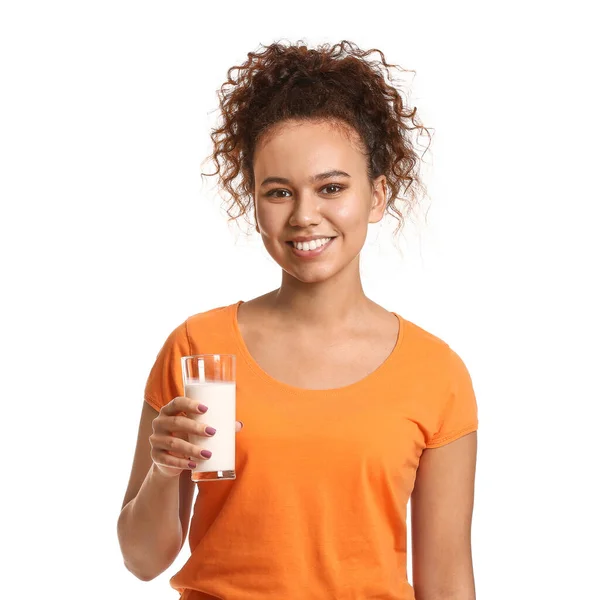 Young African-American woman with milk on white background — Stock Photo, Image