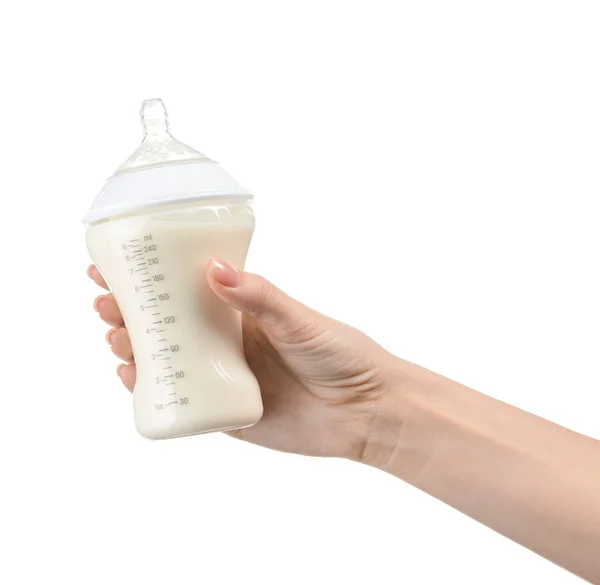 Female hand with bottle of milk for baby on white background — Stock Photo, Image