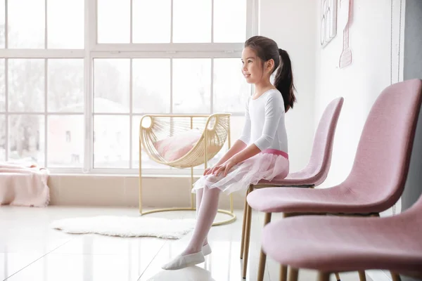 Cute little ballerina sitting in dance studio — Stock Photo, Image